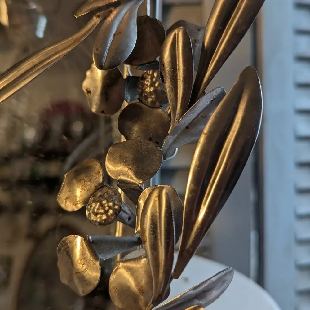 Vintage handcrafted silver-toned floral toleware mirror